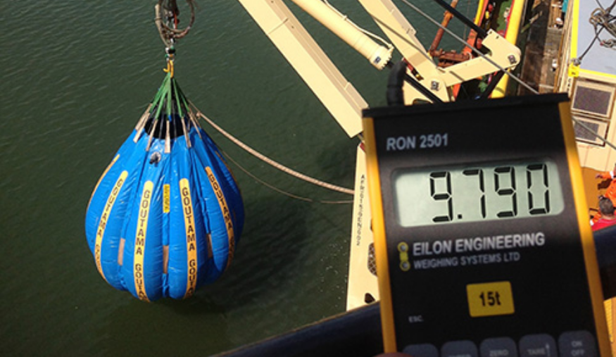  A water bag and load cell are used to perform a load test on a marine crane
